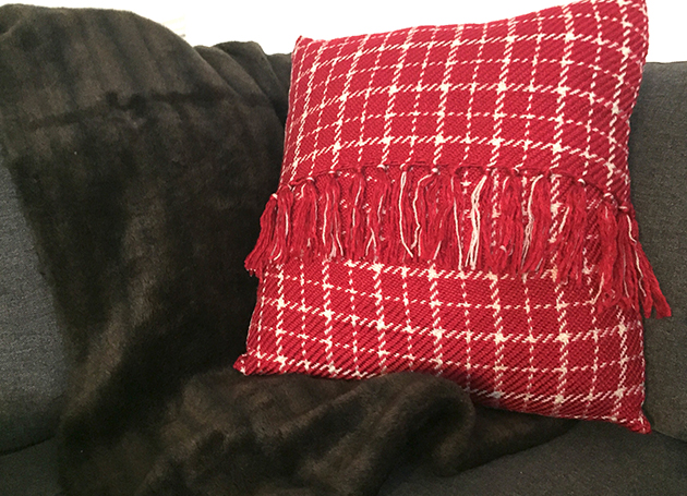 Turn a blanket into a beautiful part of your decor with this quick-sew, zipper-free, fringed pillow project. Whether it’s a blanket you just bought, something that was passed down to you from a loved one or something you found at a thrift shop, the end result will be fabulous.
